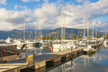 Fototapeta na wymiar Mediterranean port. View of yacht marina of Porto Montenegro . Montenegro, Adriatic Sea, Bay of Kotor, Tivat city