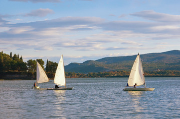 Fototapeta premium Beautiful Mediterranean landscape with sailboats on the water. Montenegro, Adriatic Sea, Bay of Kotor, Tivat
