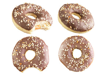 4 Four isolated chocolate donuts shot into a stack. Photographed by stacking.