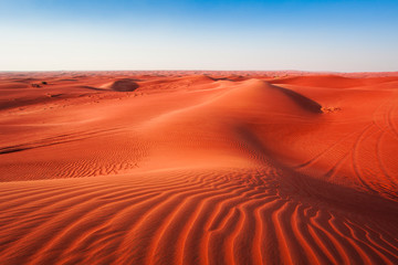 Fototapeta na wymiar desert sand and dunes with clear blue sky. Asia