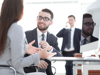 Confident man talking to his interviewer during a job interview