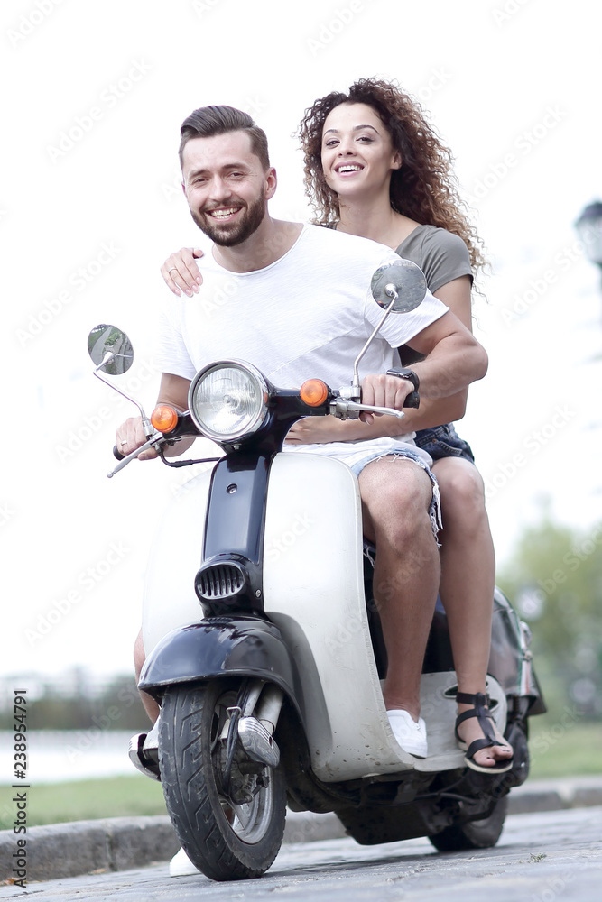 Sticker Happy cheerful couple riding vintage scooter. Travel concept.