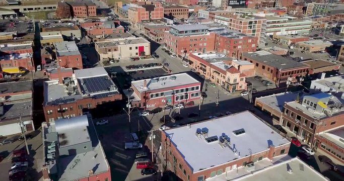 Backwards Drone Flight Tilts Up to Reveal Kansas City Skyline