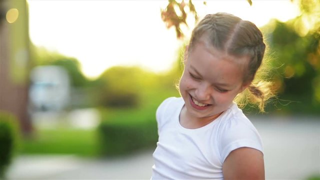 Portrait of Happy Laughing Girl. She is Smiling and Having A Lot of Fun.