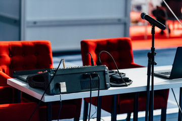 Press Conference Hall. Two Red Chairs, Microphone And Sound Mixer