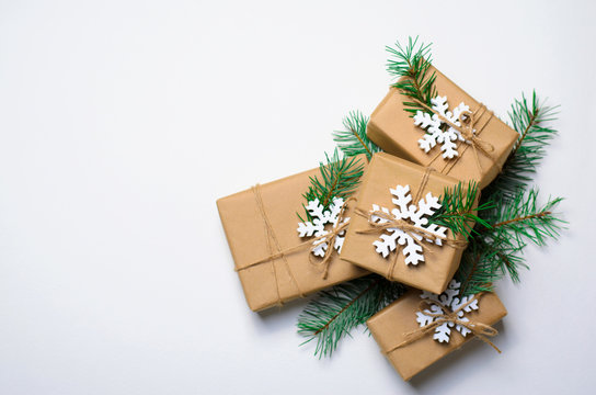 Christmas Gifts with Fir Branches on White Background, Winter Holidays Concept