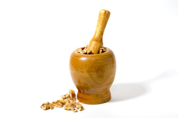 Walnuts in a wooden mortar and pestle_