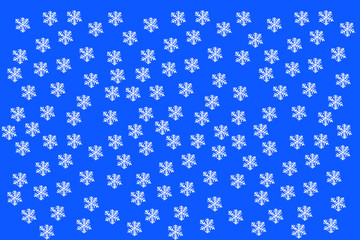 Snowflakes on a blue background. Christmas version of snow.