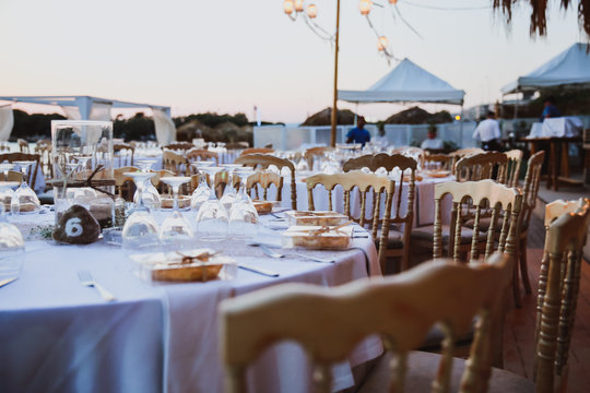 Elegance table set up for wedding in beige. Wedding dinner set up near the sea