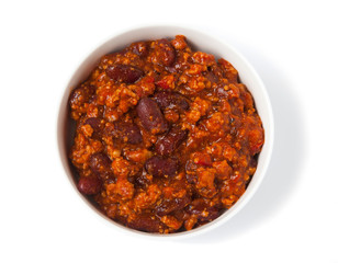 Chili con carne, isolated on a white background in a white bowl. Top view.