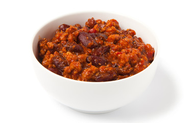 Chili con carne, isolated on a white background in a white bowl.
