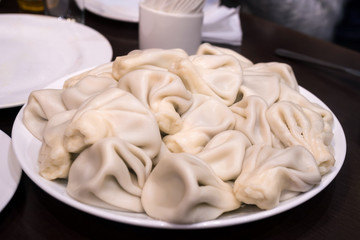 Khinkali - Georgian traditional food. Handmade rustic worldwide recipe book