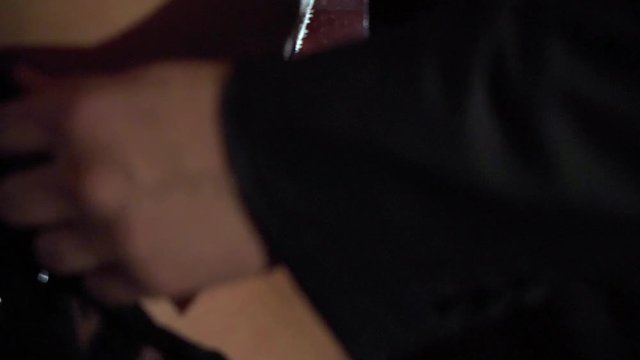 Young sexy couple at night near window. Man undressing woman, removing her dress. Girl staying naked before having sex in hotel or bedroom slowmotion.