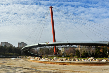 Suspension bridge in Drumul Taberei Park, also known as Moghioros Park, in Bucharest, Romania