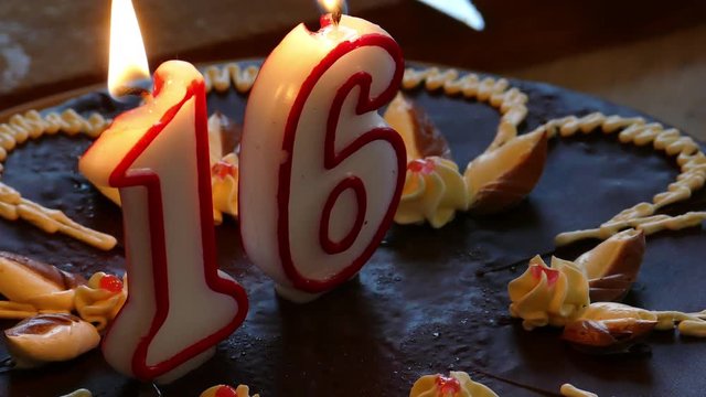 Sixteenth Birthday cake with burning numerical candles