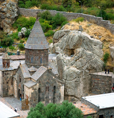 Tourists visiting Geghard monastery complex