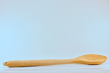 wooden spoon isolated on a white background with copy space above