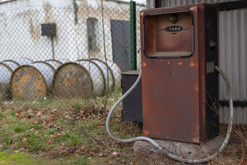 An old car fuel distributor. Abandoned gas station in the countryside.