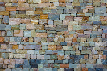 the texture of the walls of coloured stones