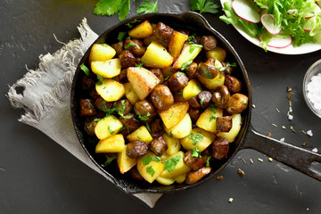 Roasted potatoes with mushroom and sausages