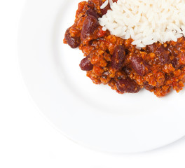 Chili con carne with rice, to white plate, isolated on a white background. Top view.