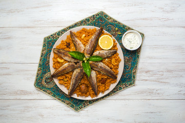 Fish Kabsa - mixed rice dishes that originates in Yemen. Middle eastern food.
