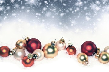Merry Christmas. Winter holiday background with Christmas balls on snow. 