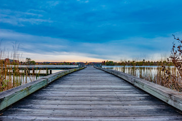 Wooden pier on the lake at sunset