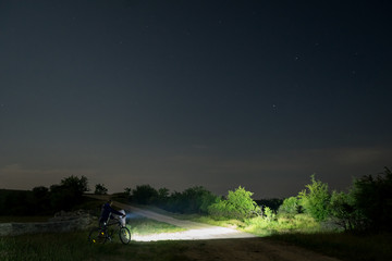cyclist on the road by night