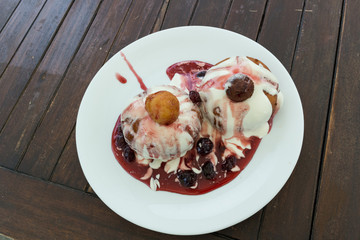 cheese pancakes with cream and cherry jam
