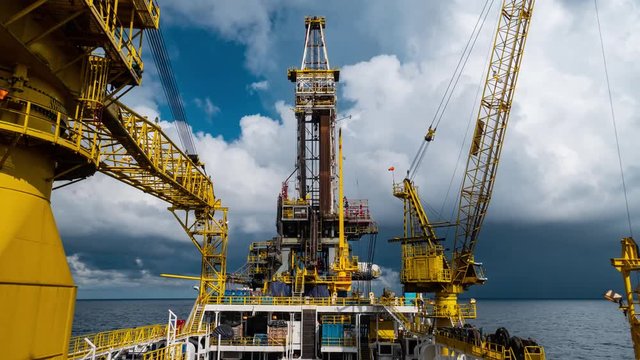 Time-lapse of derrick of Tender Assisted Drilling Oil Rig (Barge Oil Rig) on The Production Platform