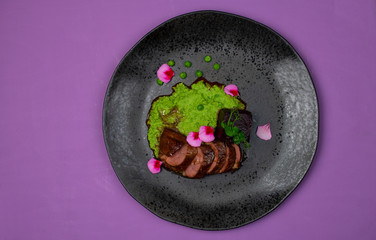 Glazed duck fillet with green sauce