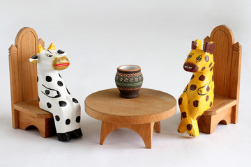 Wooden cow and cheetah - unequal negotiations - to become its food or to become its comrade