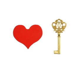 Red painted wooden heart and bronze key isolated on white background