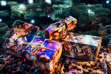 Wrapped Christmas Presents Under the Christmas Tree with Lights