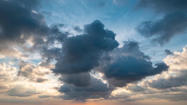 Time-lapse of clouds moving during sunset, day light to night bright colors dramatic dawn nature background