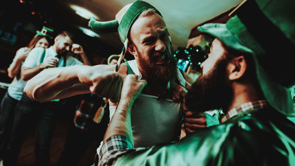 Two Men Fight In Pub. Saint Patrick's Day Concept.
