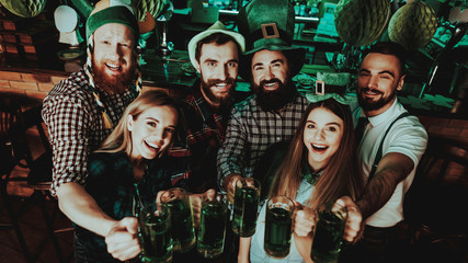 Young Company With Beer Glasses. St Patrick's Day.