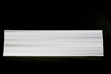 paper stack on black background