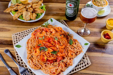 pasta with tomato sauce and vegetables  with shrimps