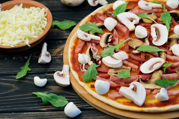 Tasty and flavorful pizza on the table. Appetizing homemade pizza.