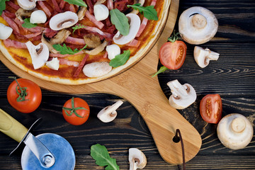 Tasty and flavorful pizza on the table. Appetizing homemade pizza.