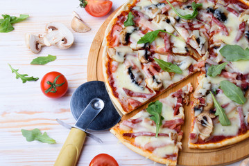 Tasty and flavorful pizza on the table. Appetizing homemade pizza.
