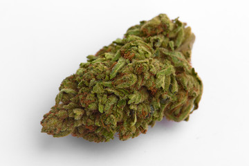 Close up of prescription medical marijuana and recreational weed hybrid sticky peaches cake strain flower bud isolated on a white background