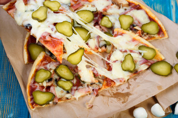 Tasty and flavorful pizza on the table. Appetizing homemade pizza.