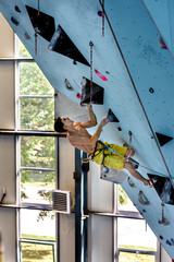 Sport training. Strong athlete on a climbing wall,