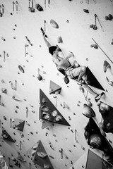 Climbing gym. Sport training. Athlete on a climbing wall, indoor