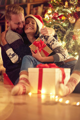 Fototapeta na wymiar love, happiness for Christmas, concept- smiling couple in love at Christmas .