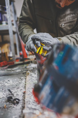 Male worker repairing Stone, edge sharpening in ski service workshop, sliding surface of the skis. sharpening of an edging of a mountain skis by means of the individual tool. Theme repair of ski curb