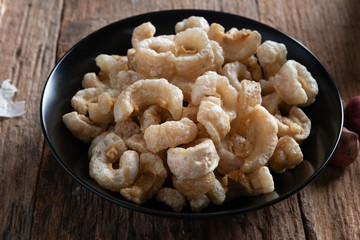 Pork rinds also known as chicharon or chicharrones , kab moo